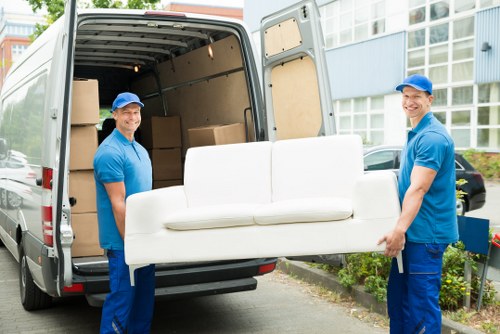 Removal team preparing a move in a busy Soho street