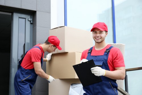 Local removalists loading boxes for a Soho house move