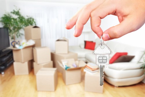 Office relocation team planning a move in Soho with boxes and office furniture