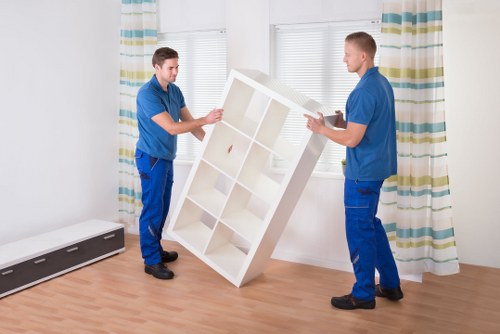 Commercial moving team handling office furniture in Soho