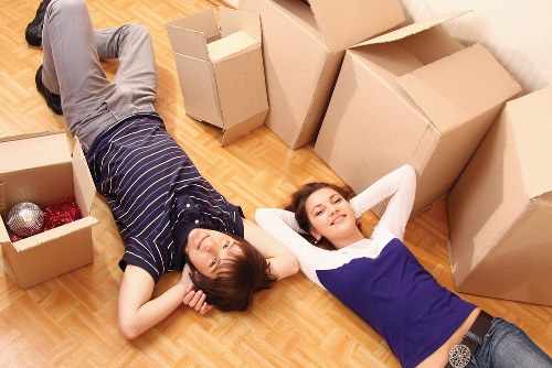 Packed boxes and furniture protection ready for a flat removal in Soho